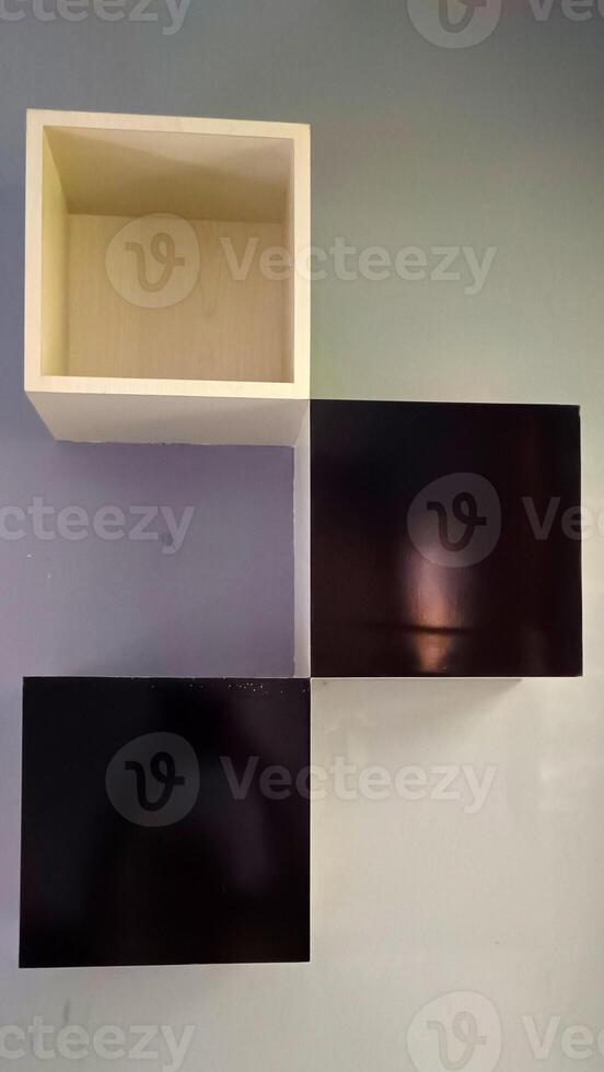 Three box shelves on the wall photo