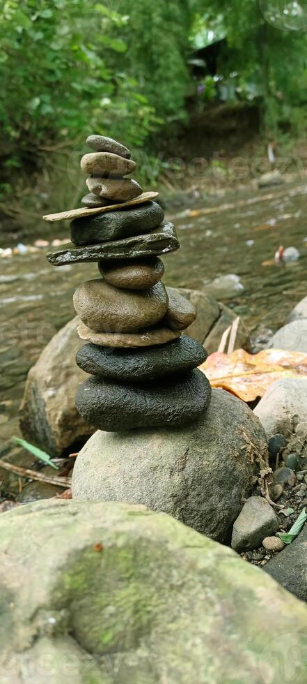 Close up of stacks of rocks on the river bank photo