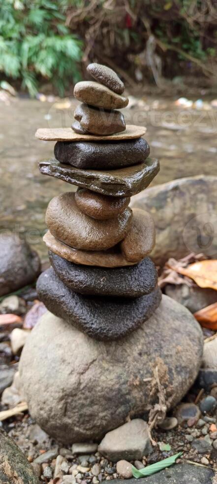 Close up of stacks of rocks on the river bank photo