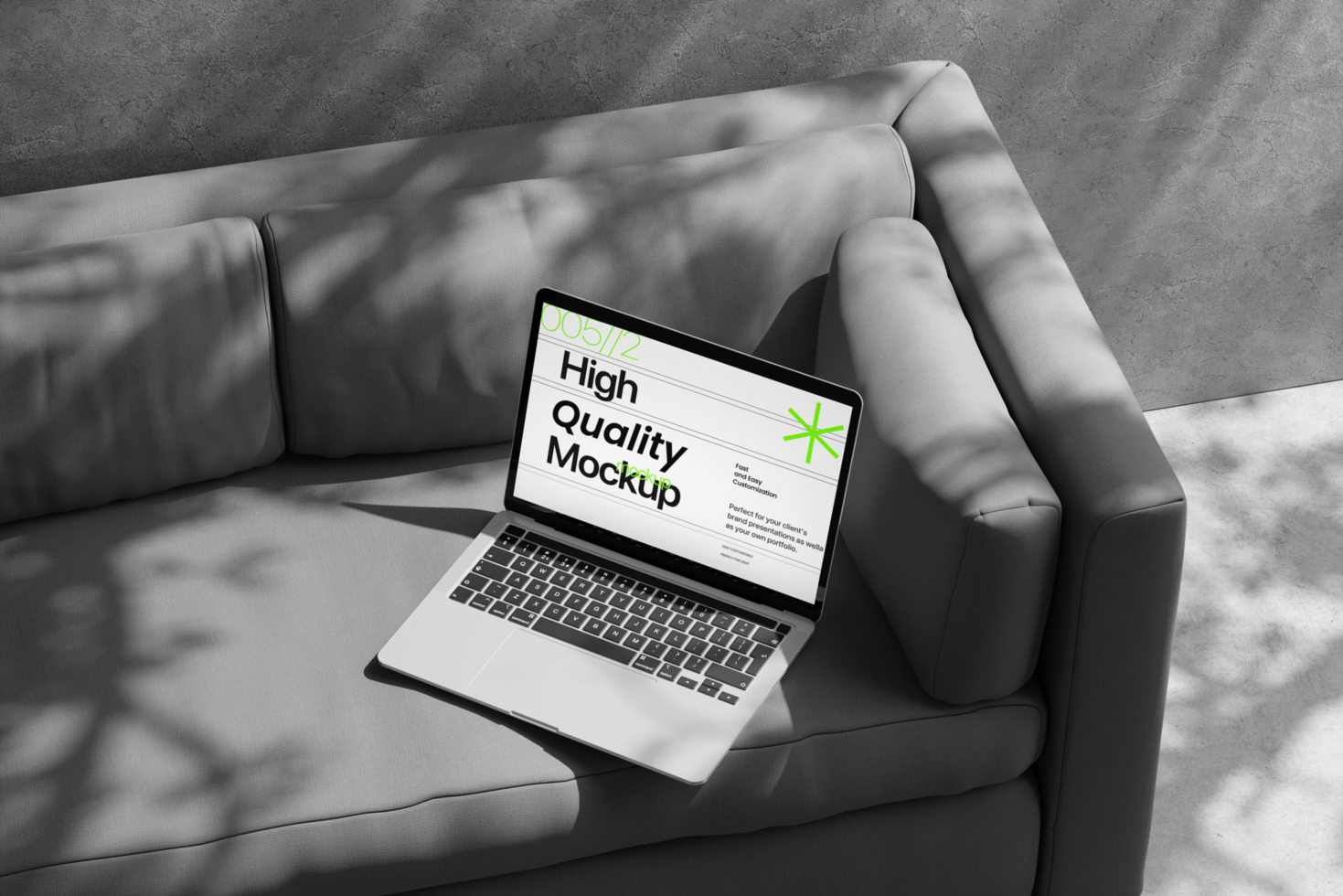 Laptop mockup on the sofa with shadow and wall scene psd