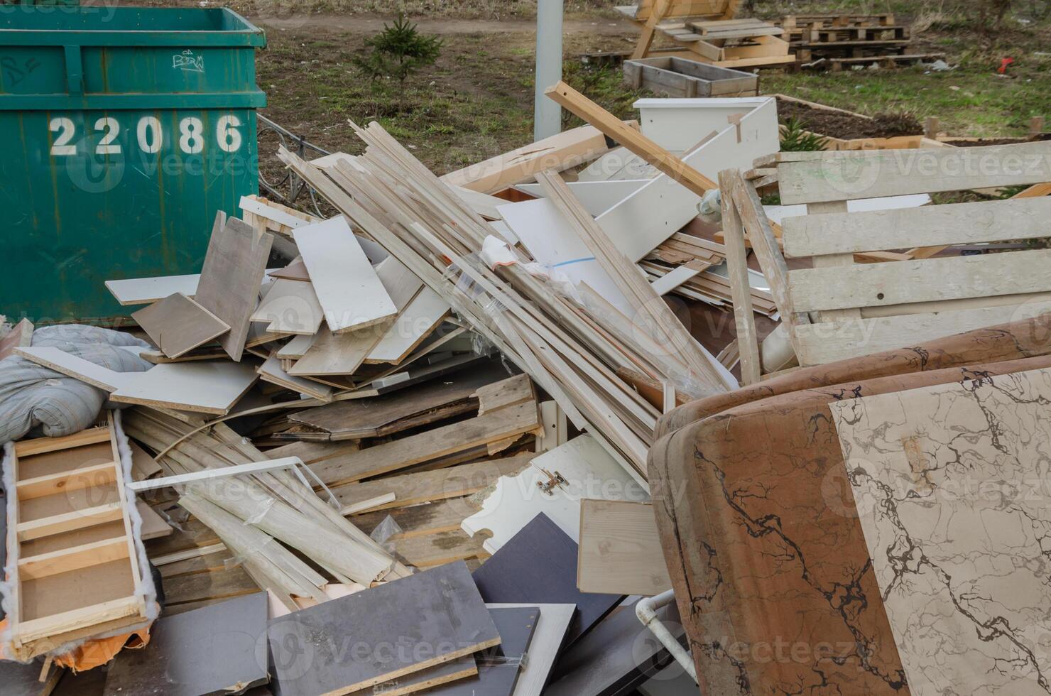 Garbage is lying in the city next to residential buildings photo