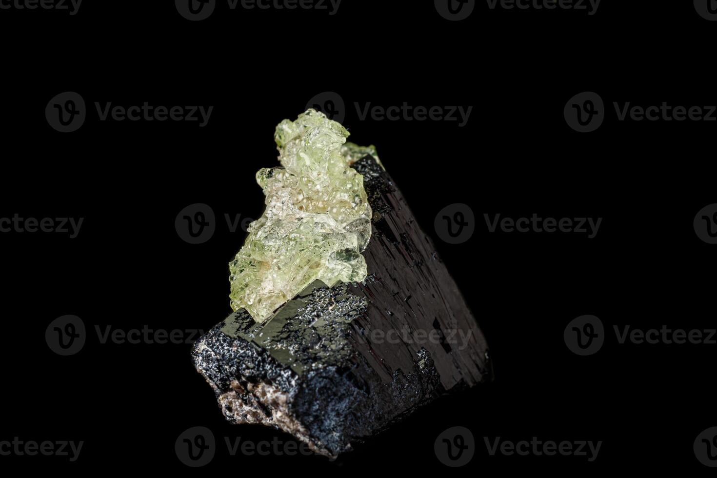 Macro stone Hyalite mineral, tourmaline Sherl, smoky quartz on a black background photo