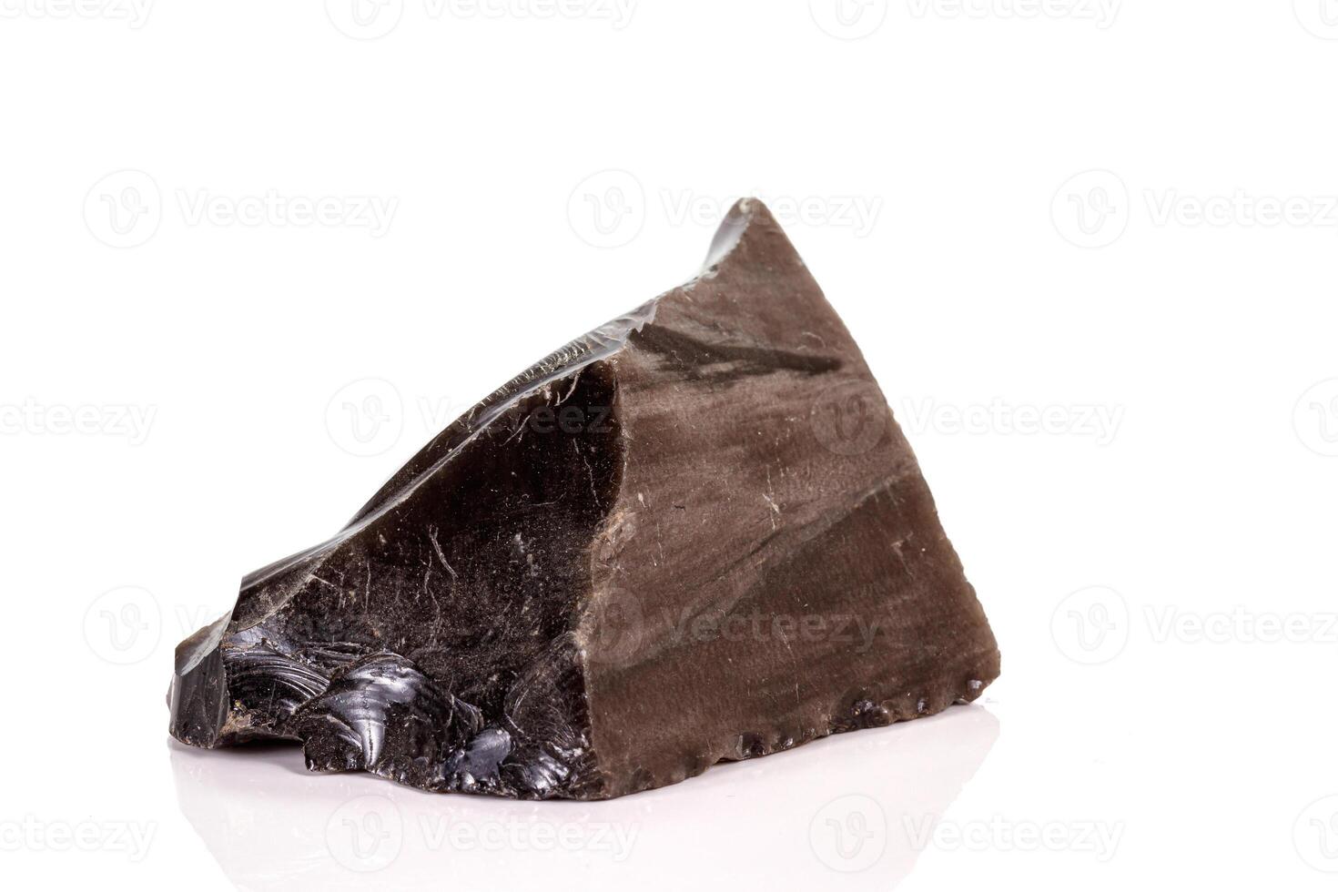 Macro stone obsidian mineral on white background photo