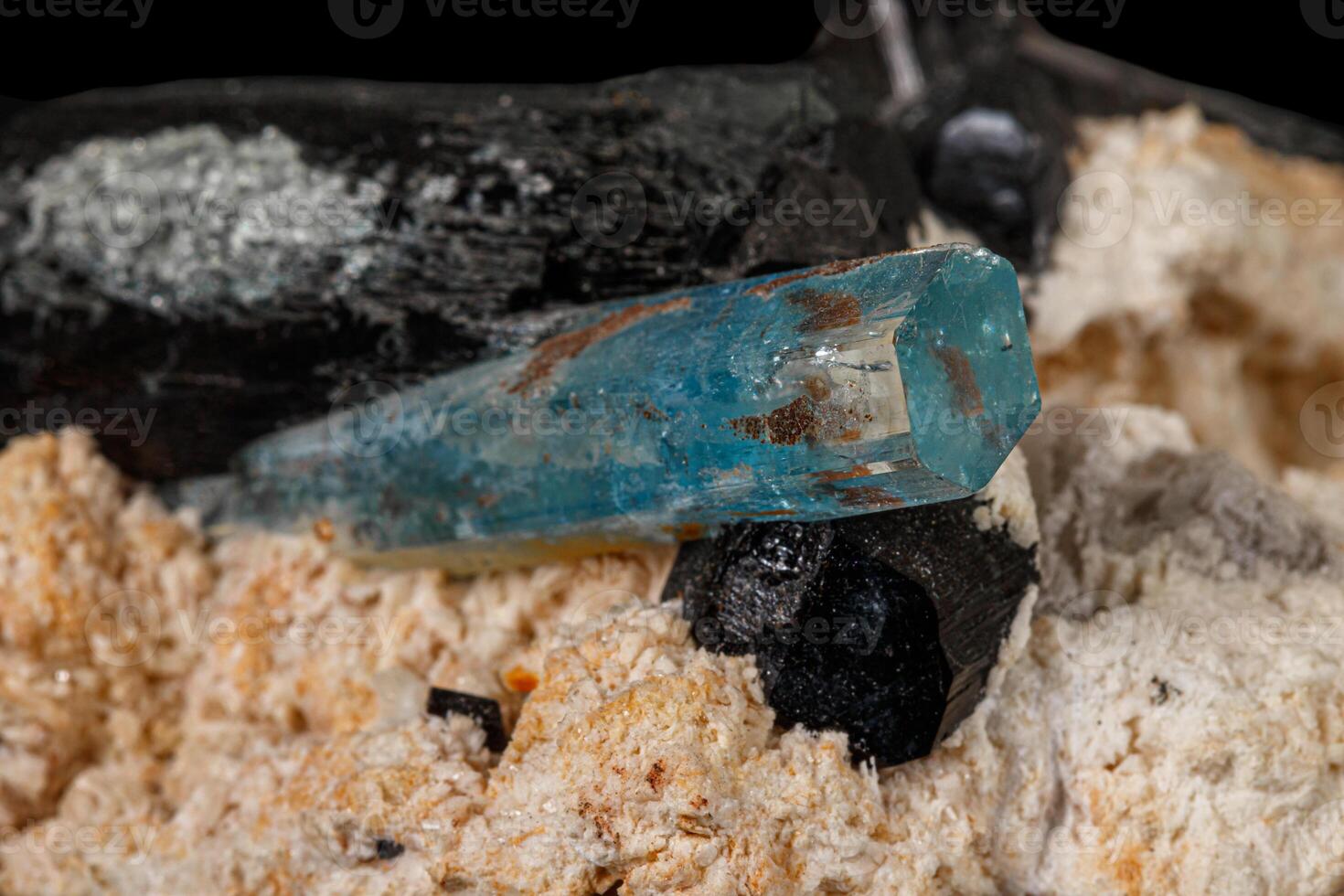 Macro stone mineral tourmaline aquamarine with a black background photo