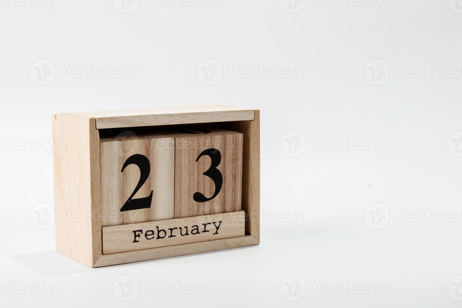 Wooden calendar February 23 on a white background photo