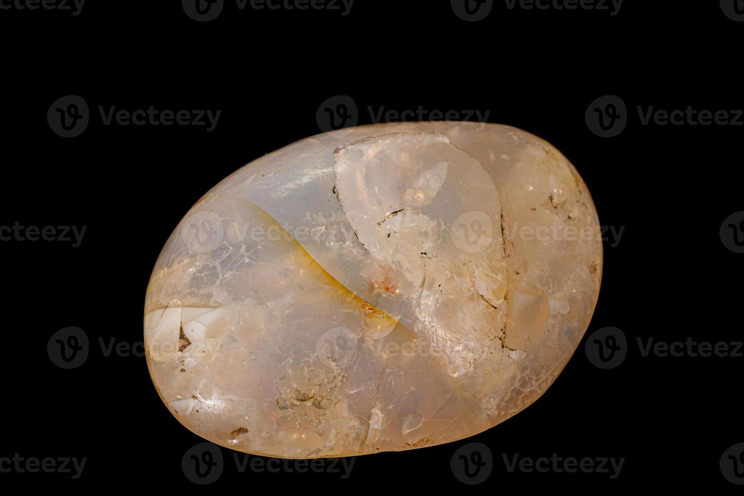 Macro stone opal mineral on a black background photo