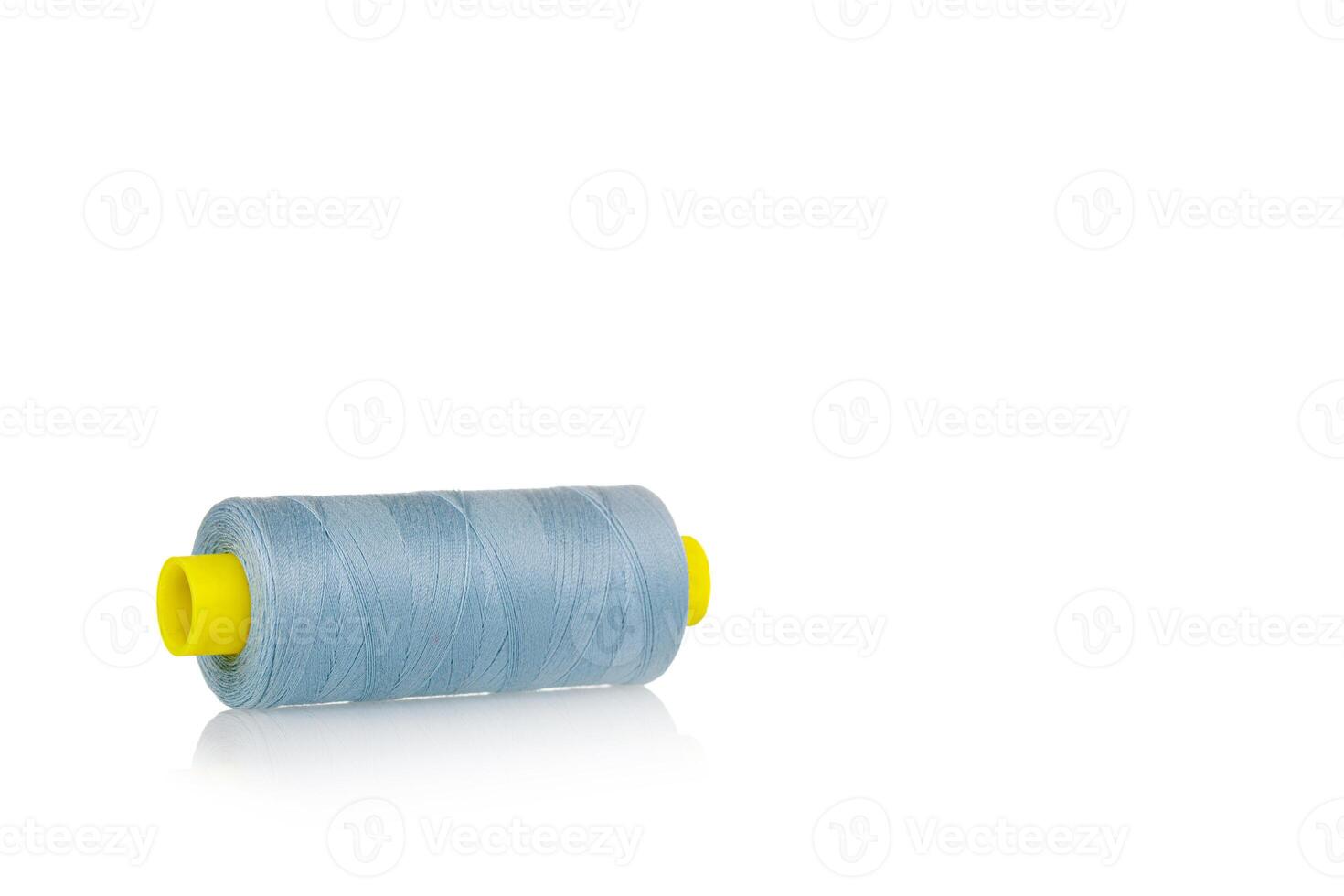 a skein of threads of blue color macro on a white background close up photo