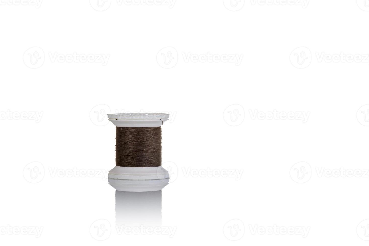 skein of thread brown colors macro on a white background photo
