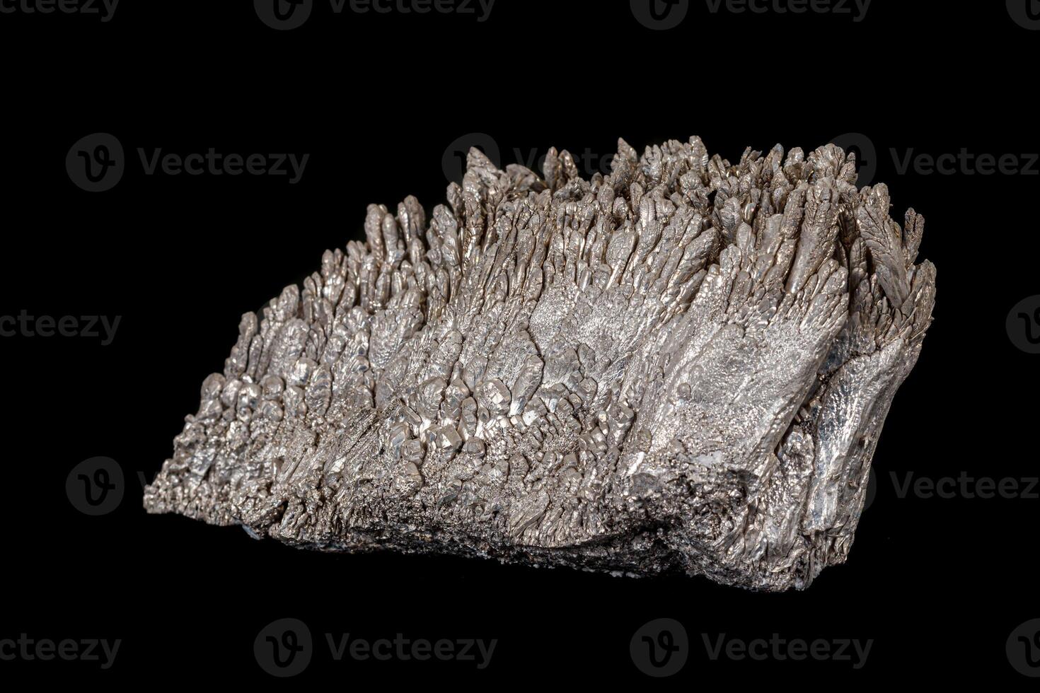 Macro of a stone Stibnite mineral on a black background photo