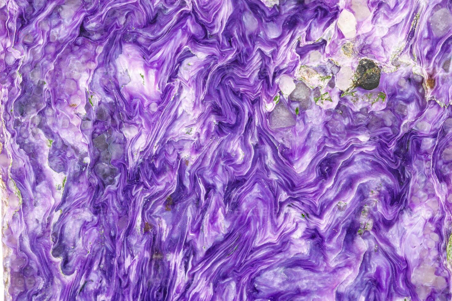 Macro stone Charoite mineral on white background photo