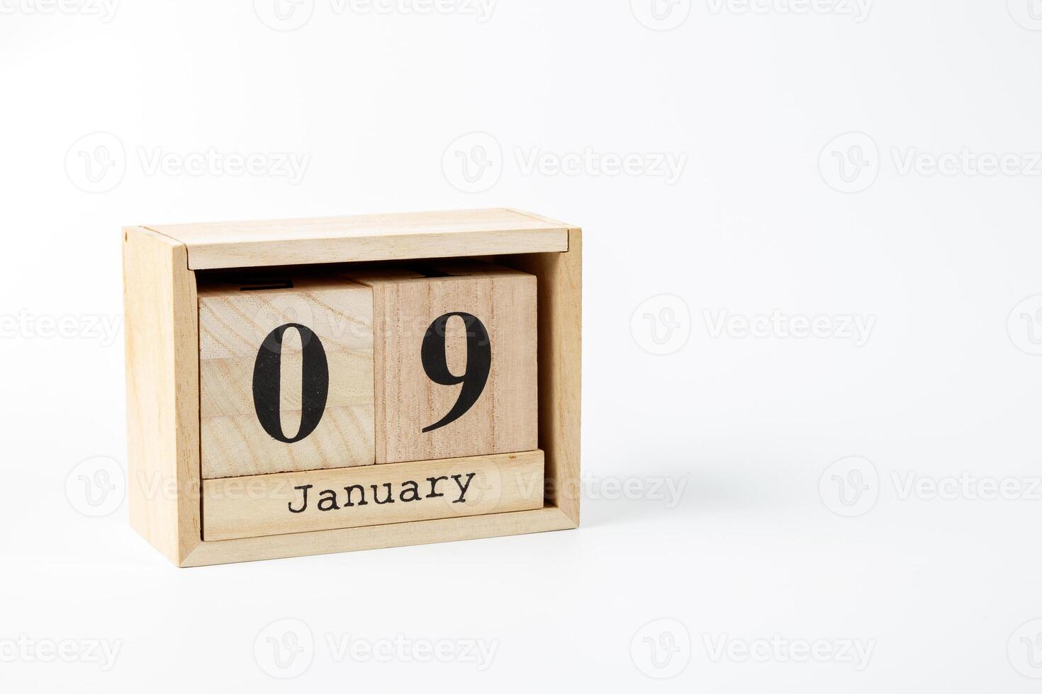 Wooden calendar January 09 on a white background photo