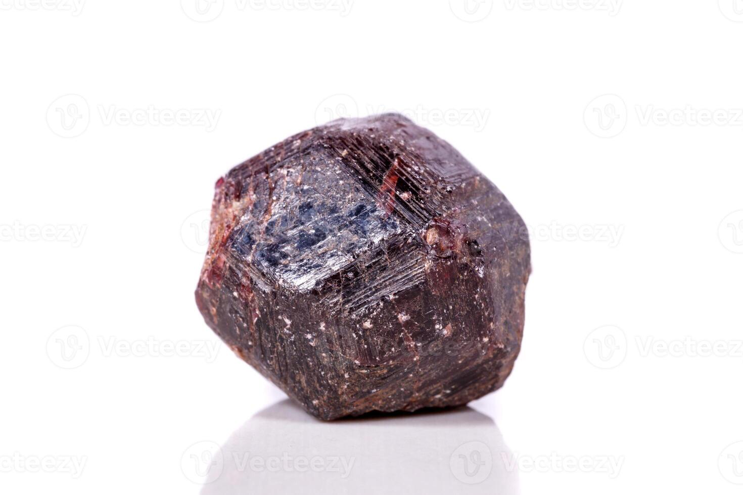 Macro of a mineral garnet stone on a white background photo