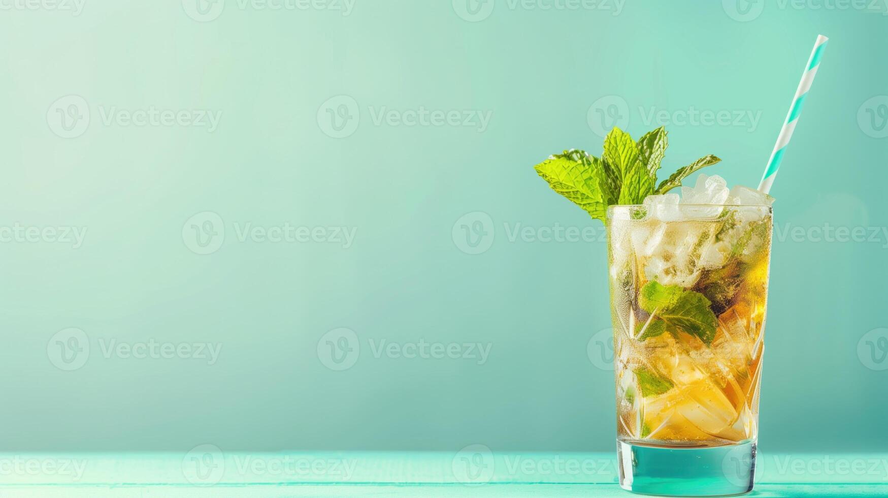 A mint julep cocktail sparkles with ice and fresh mint leaves, set against a refreshing turquoise background photo