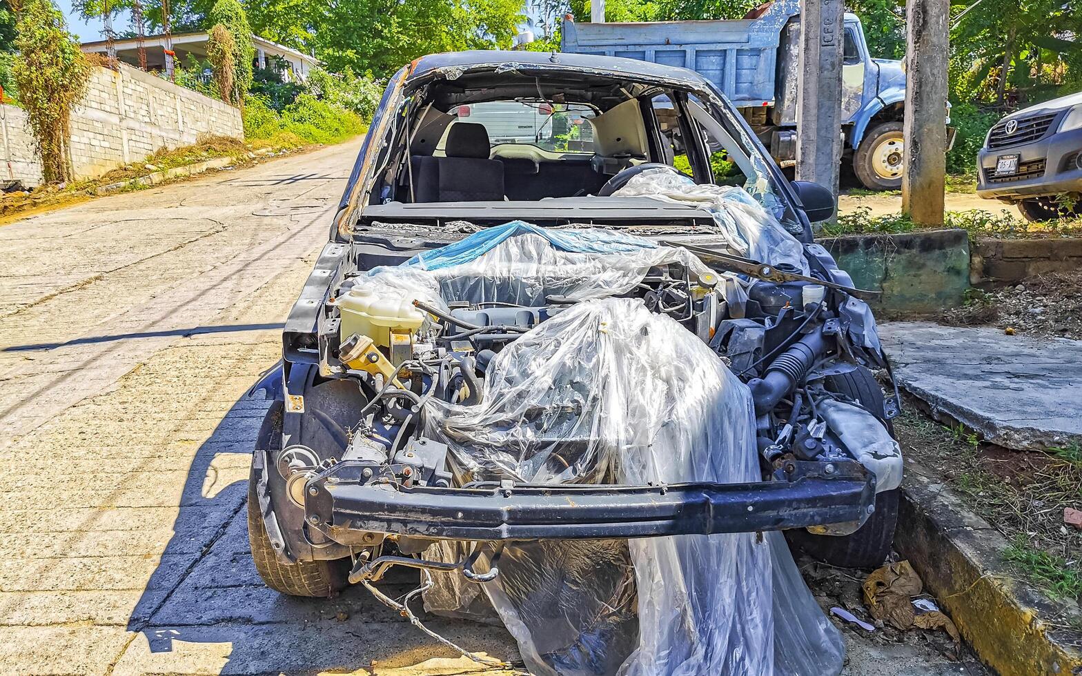 Puerto Escondido Oaxaca Mexico 2022 Broken down car Vehicle transportation in the workshop outside Mexico. photo