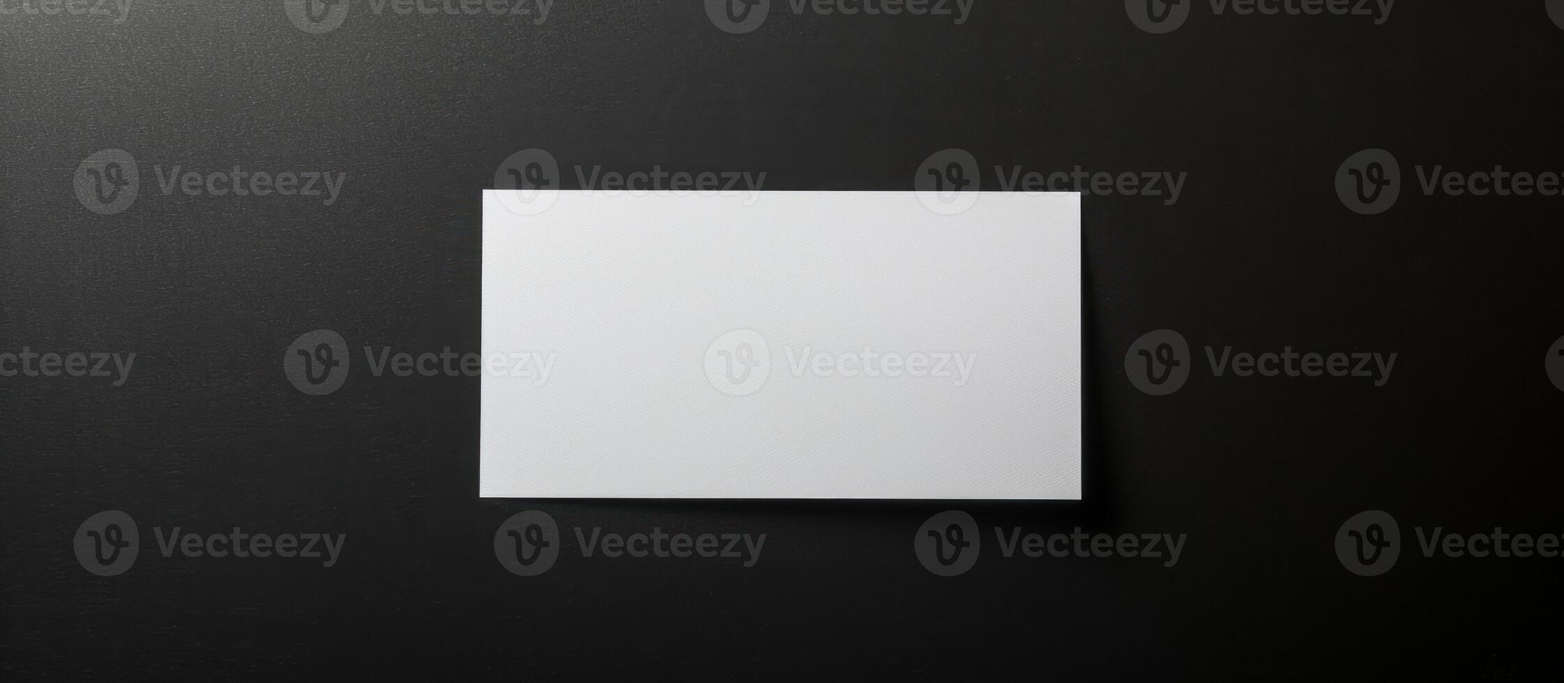 a sheet of white paper on a black background. photo