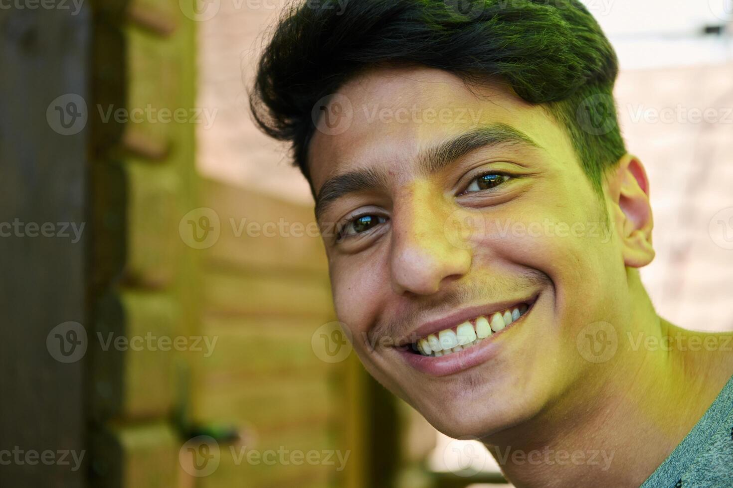 Middle Eastern Man with a Radiant Smile and Beautiful White Teeth Captured in Closeup photo