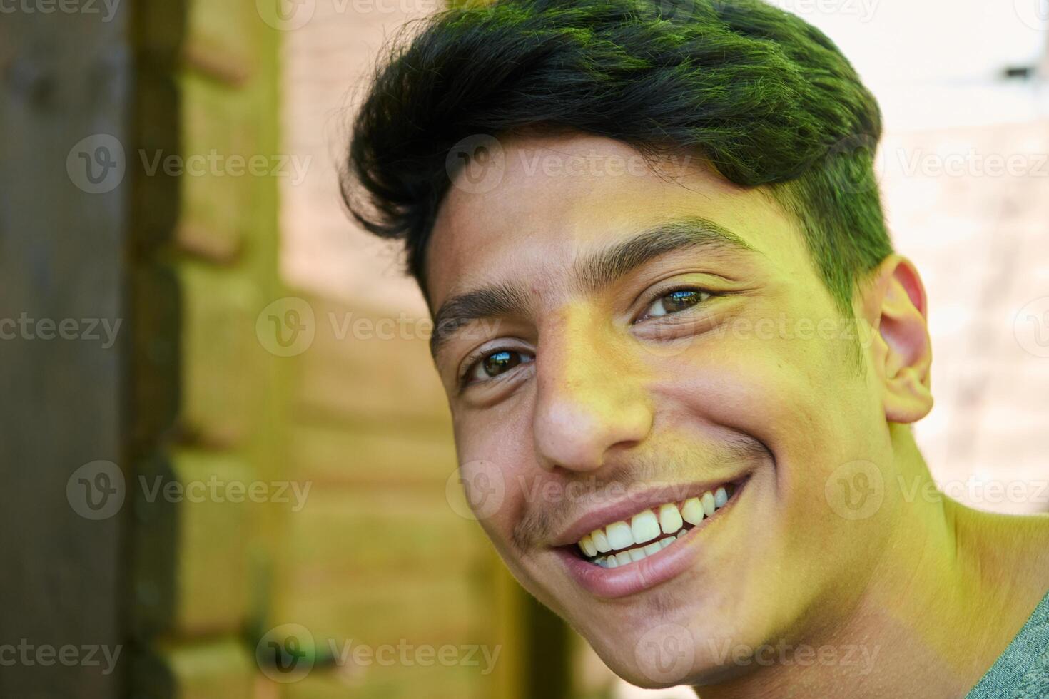 Middle Eastern Man with a Radiant Smile and Beautiful White Teeth Captured in Closeup photo