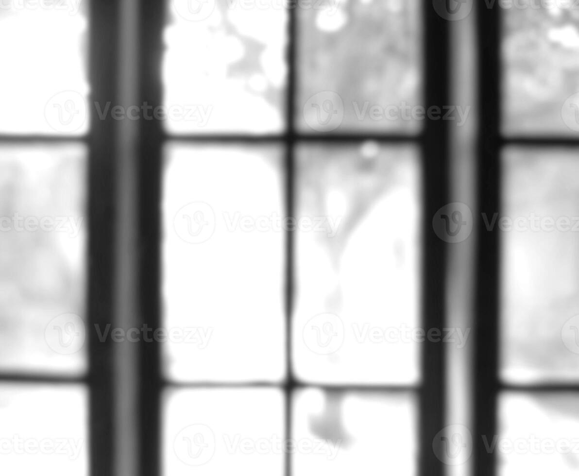 Black and white photo of blurry window glass frame out of focus, out of focus on photo inside the house