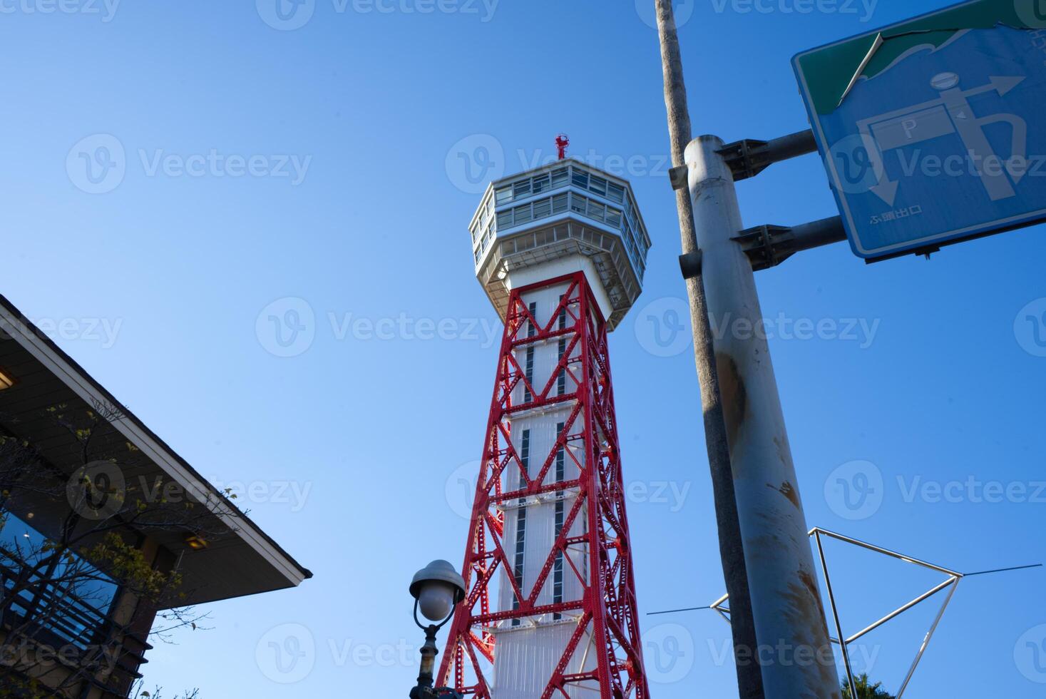 looking up view of Hakata Port Tower, a red lattice metal observation tower in the Hakata district of Fukuoka, Japan photo
