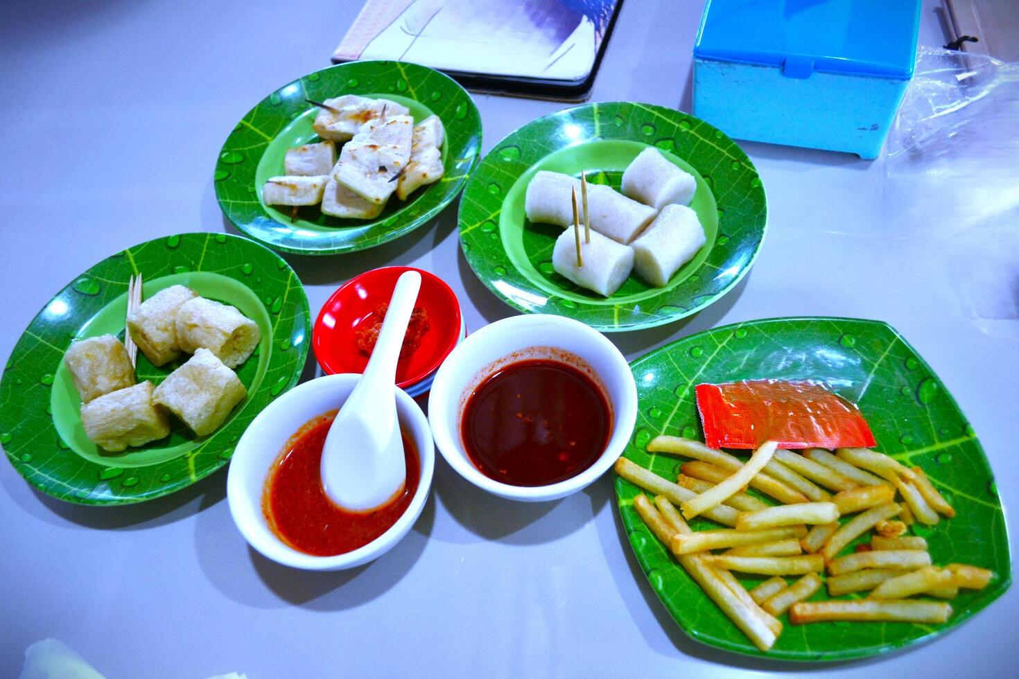 Boiled and fried dish with different sauces on the table photo