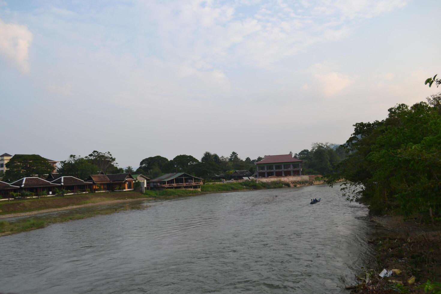 Scenic view of Namsong river by buildings against sky during twilights photo