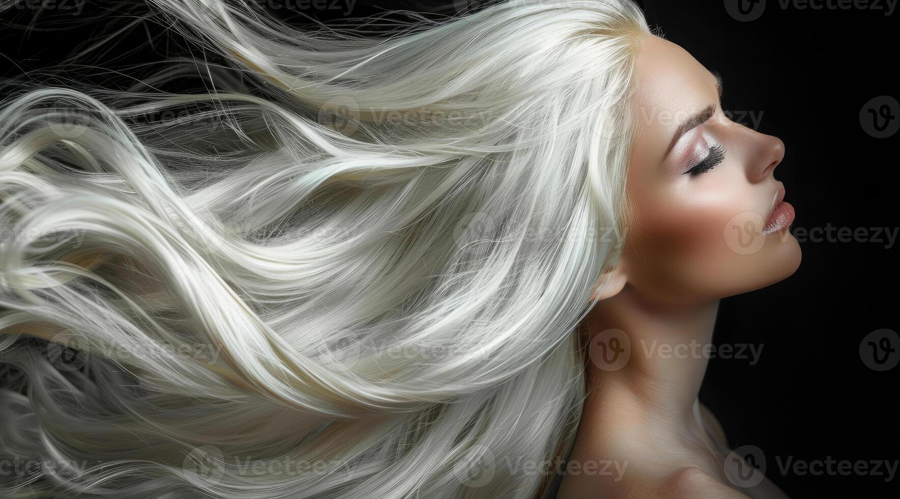 A blonde woman model with long silver hair is posing in front of a white background photo