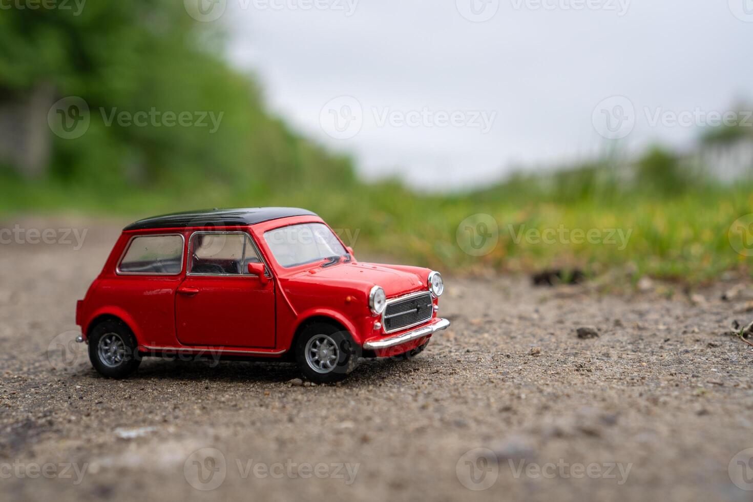 A close-up picture of a retro red toy car photo