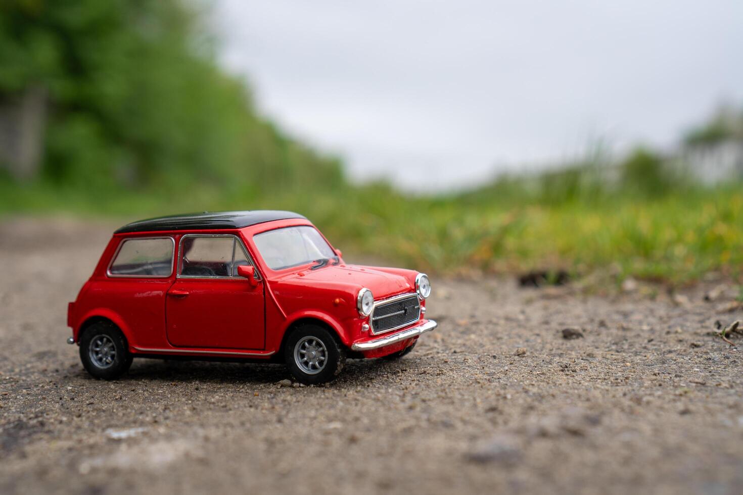 A close-up picture of a retro red toy car photo
