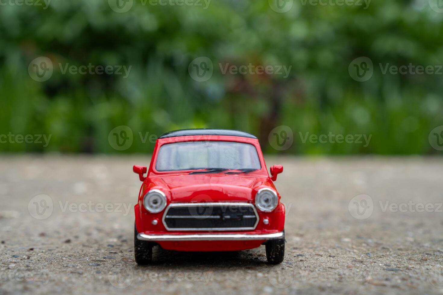 A close-up picture of a retro red toy car photo