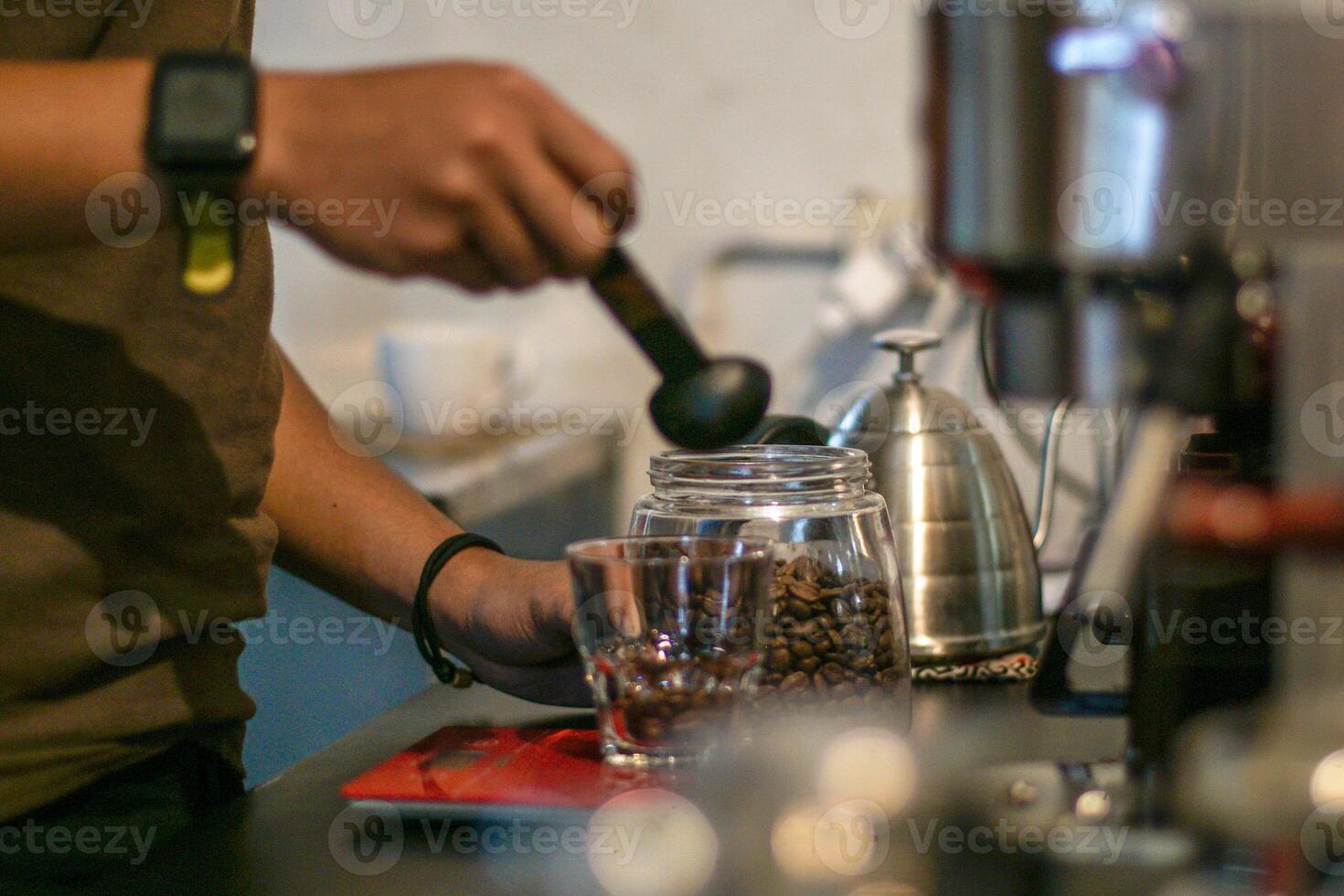 Midsection of Barista making Coffee Beverages photo