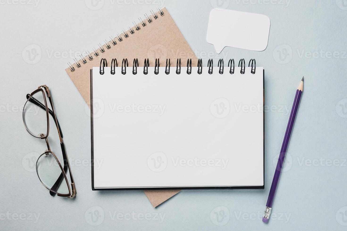 Notepad, white sticker, pensil and glasses on the desk. Mock up in copy space office background. It is important not to forget the note photo