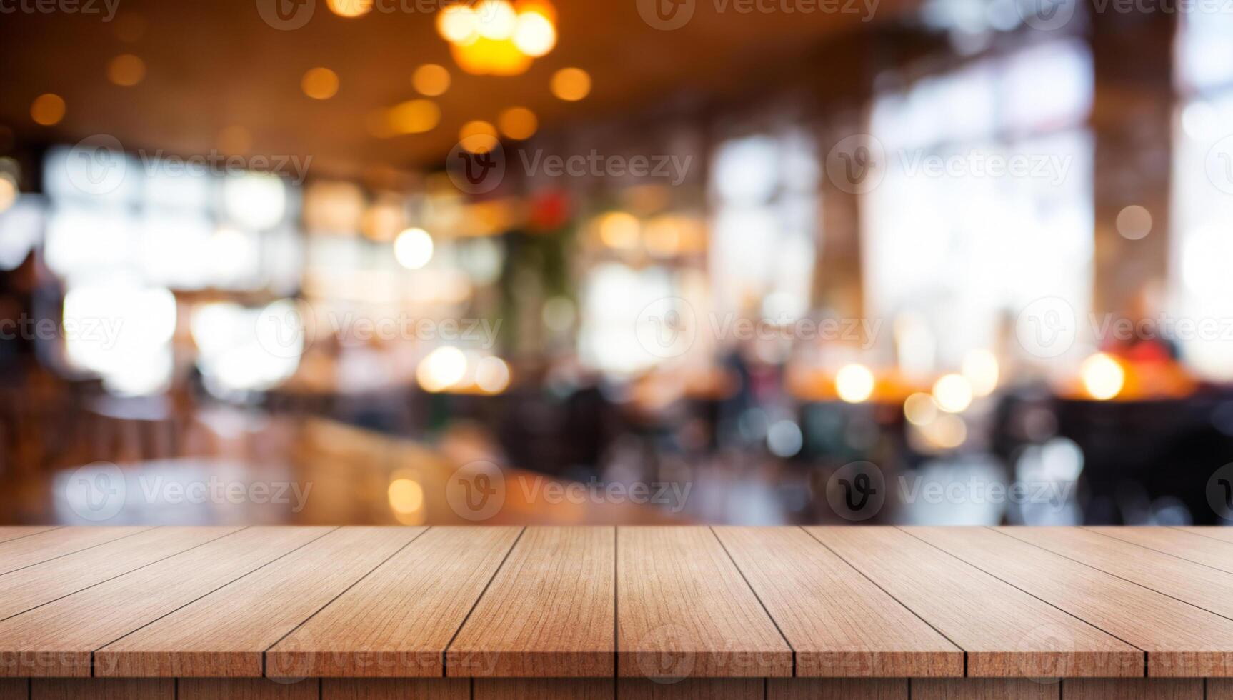 Empty wooden table top with lights bokeh on blur restaurant background. photo