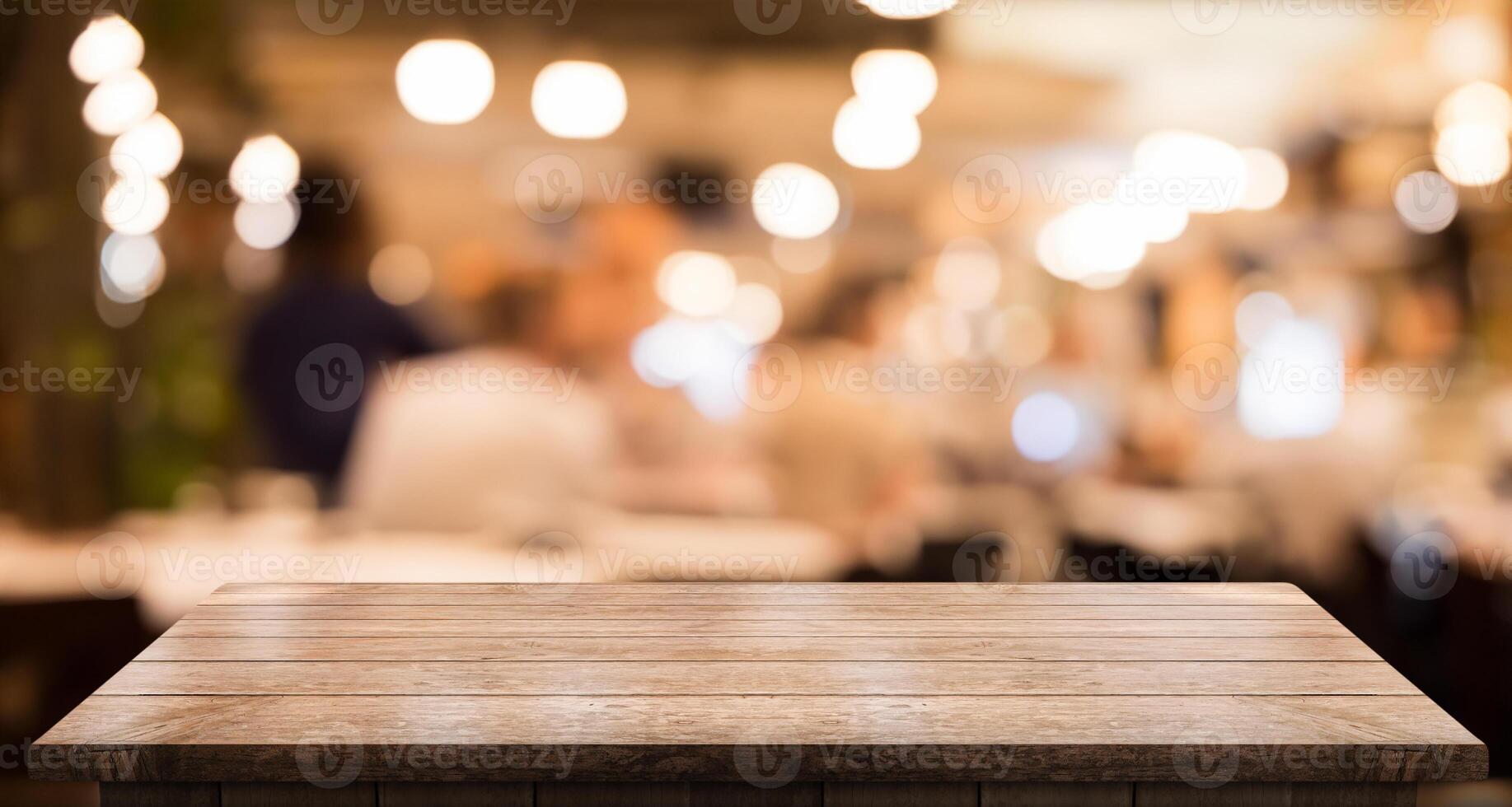 Empty wooden table top with lights bokeh on blur restaurant background photo