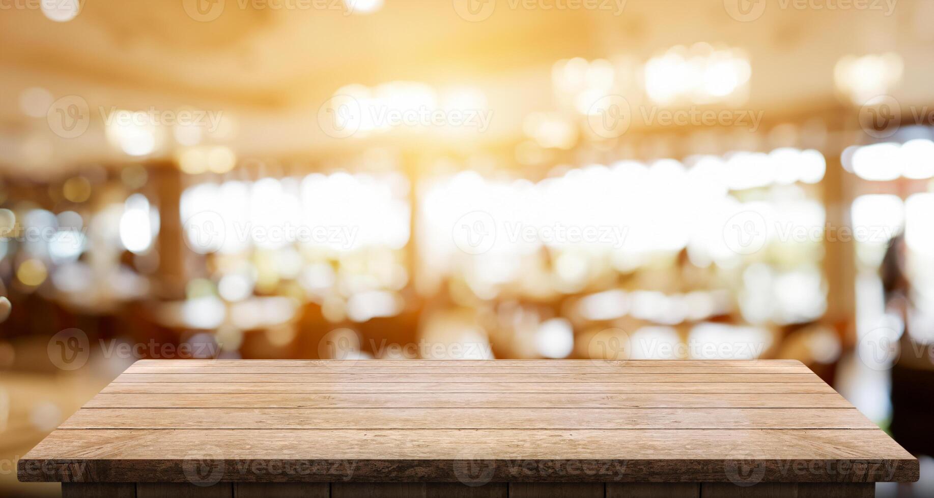 Empty wooden table top with lights bokeh on blur restaurant background photo