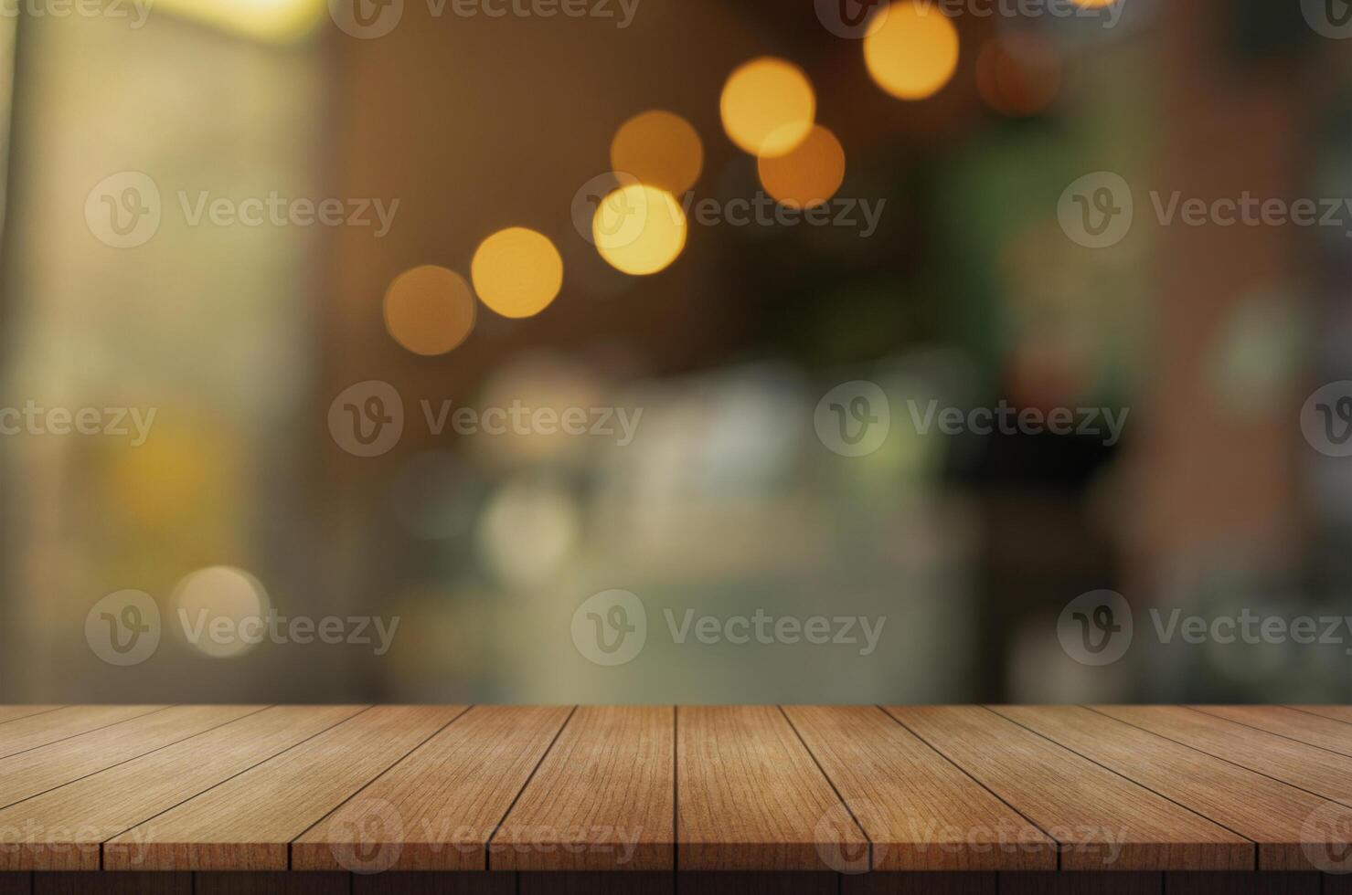 Empty wooden table top with lights bokeh on blur restaurant background. photo