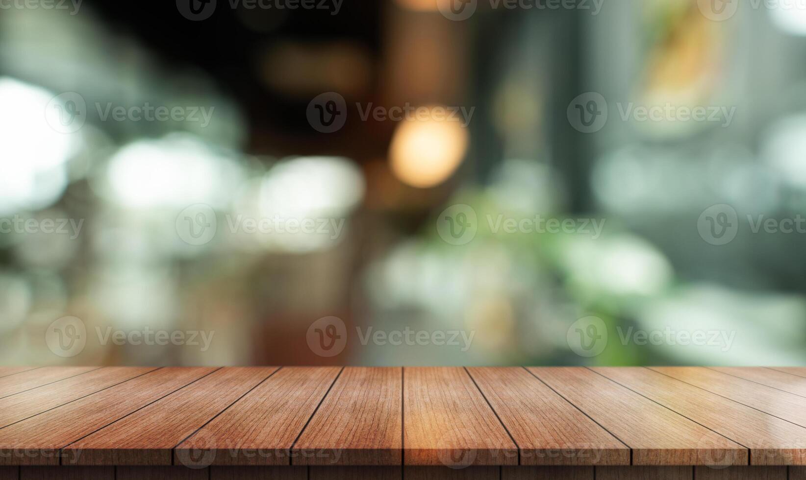 Empty wooden table top with lights bokeh on blur restaurant background photo