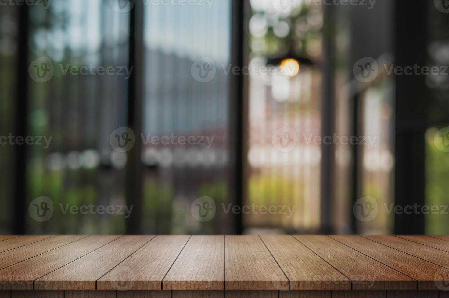 Empty wooden table top with lights bokeh on blur restaurant background. photo