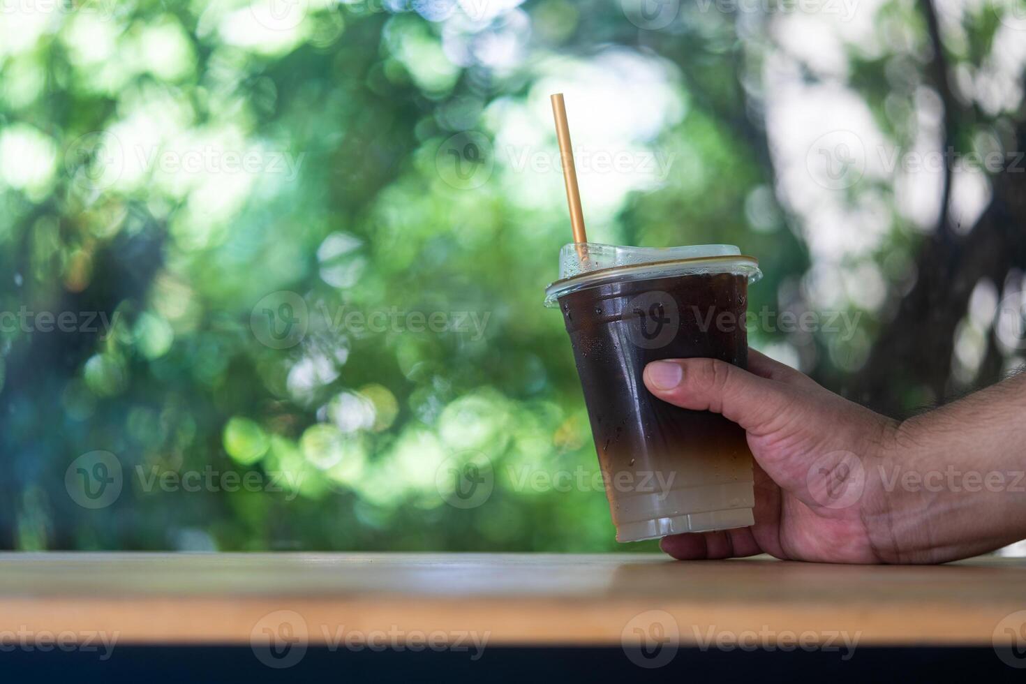 A man drinking coffee mix juice. Give a refreshing feeling. photo