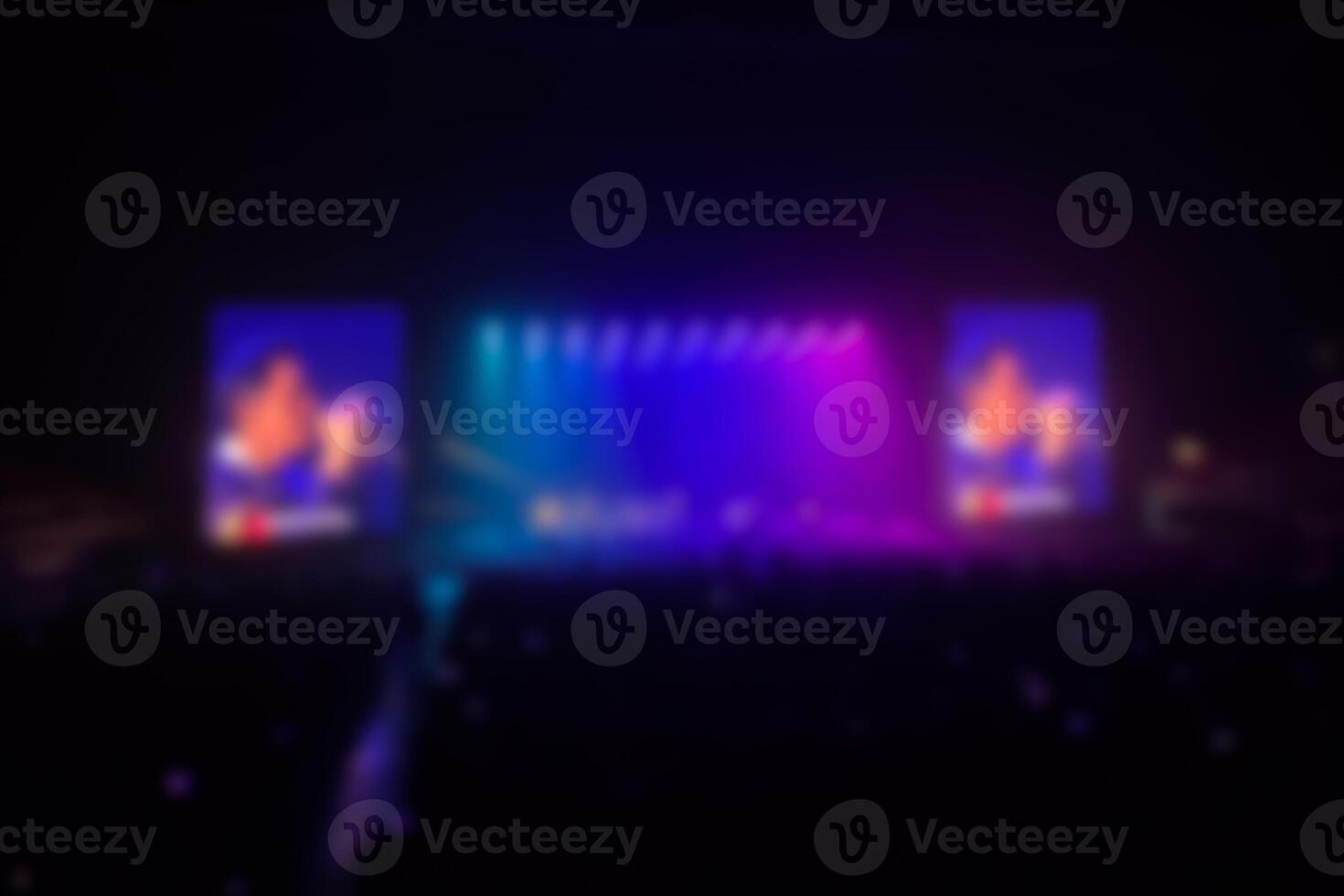 Disfocused concert stage with laser lights and beams. Stage lighting at the concert. photo