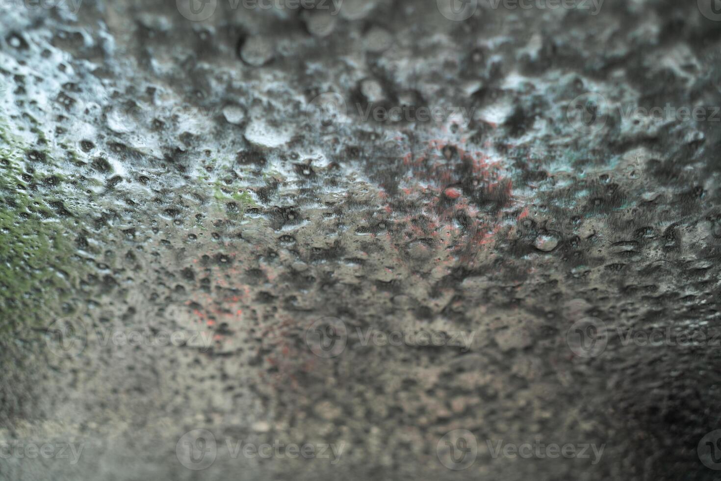 Soapy car windshield view from inside a car during an automatic wash cycle. photo
