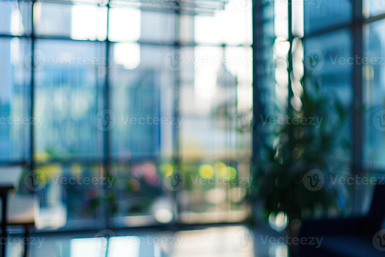Blurred office background. Lots of big windows, sunlight and office furniture photo
