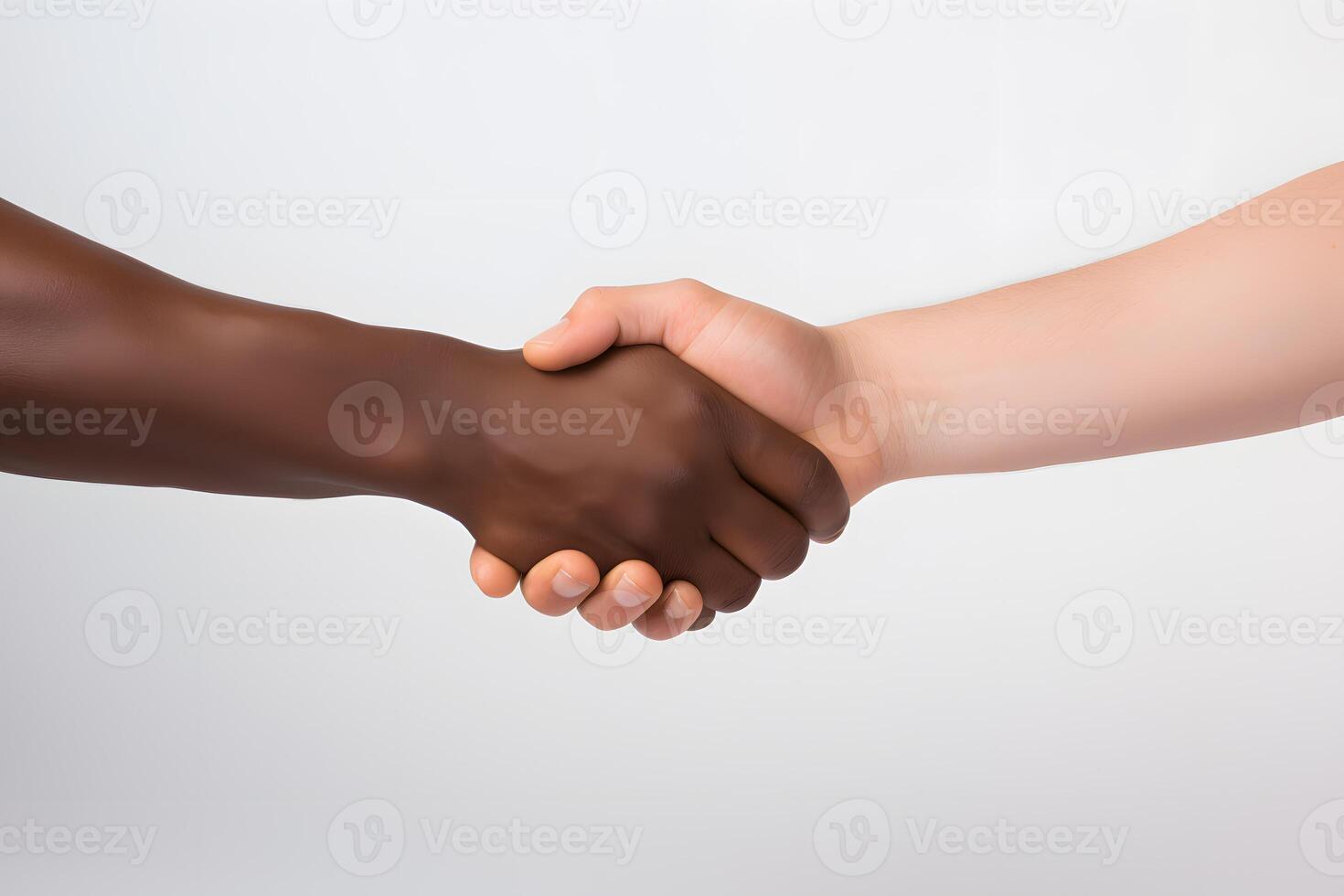 Close-up handshake between two races. No to racism photo