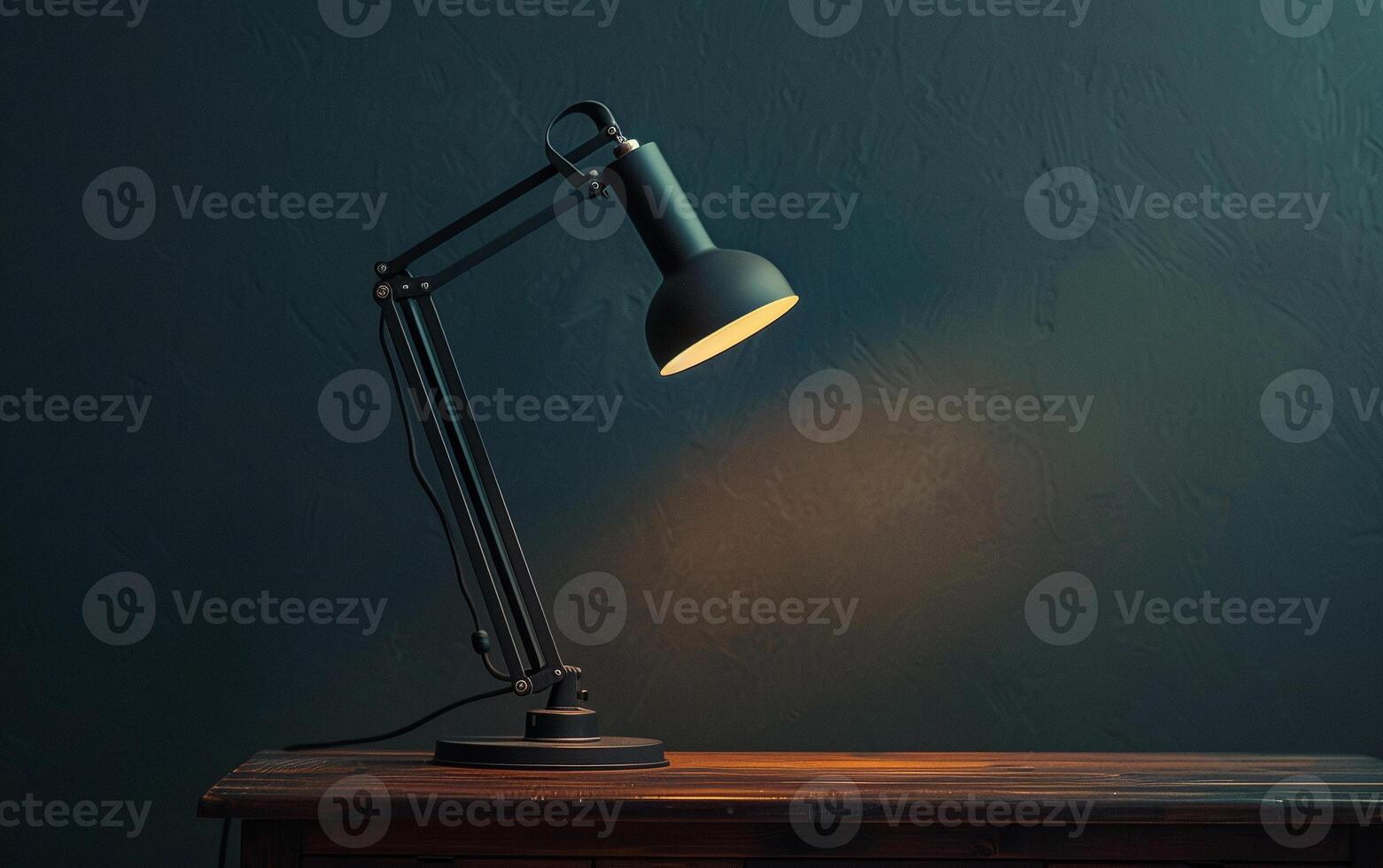 Modern and stylish desk lamp sits on the desk and illuminates minimalist empty workspace photo