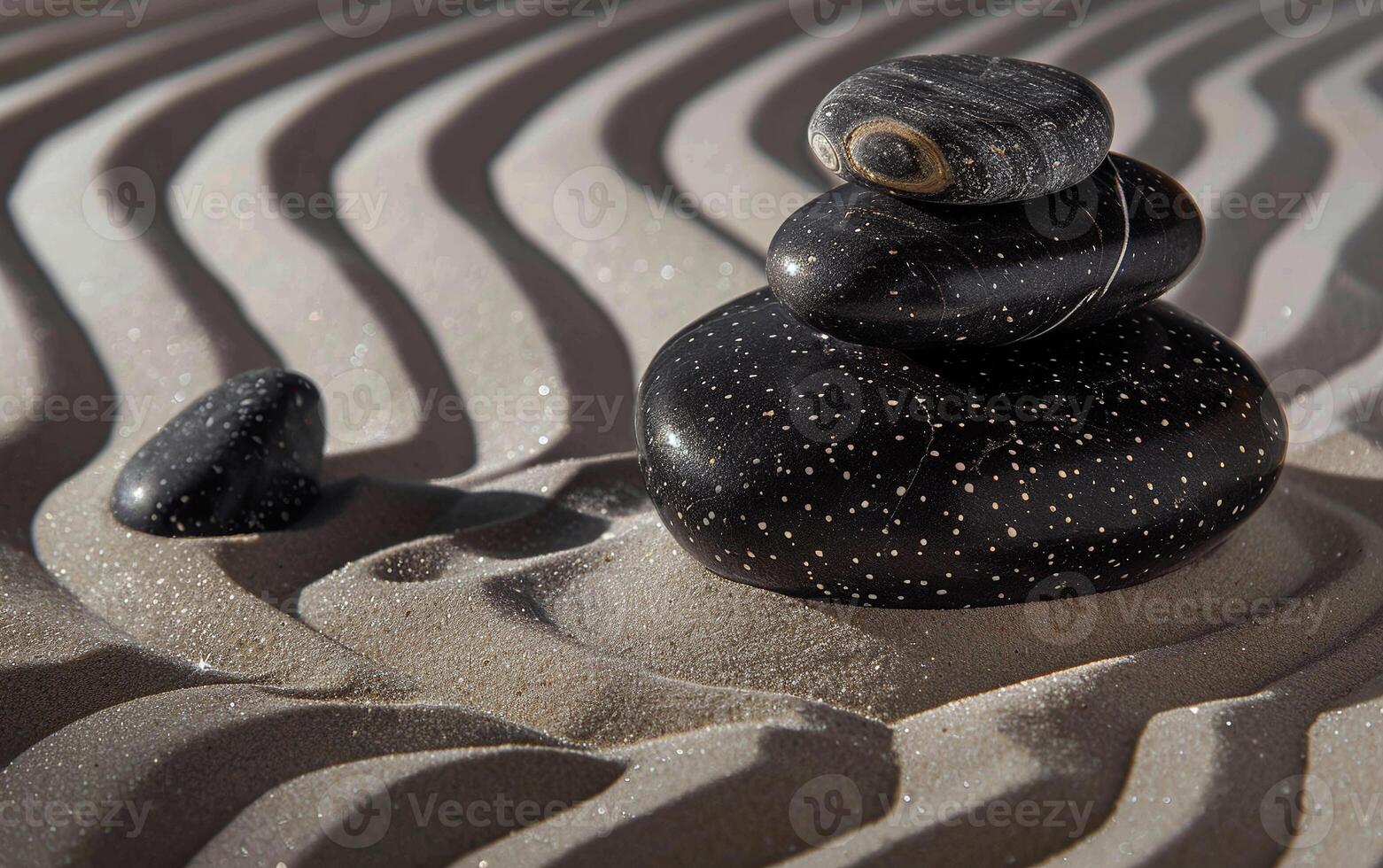 The atmosphere of meditation and tranquility is conveyed by the waves on the sand and zen stones. photo