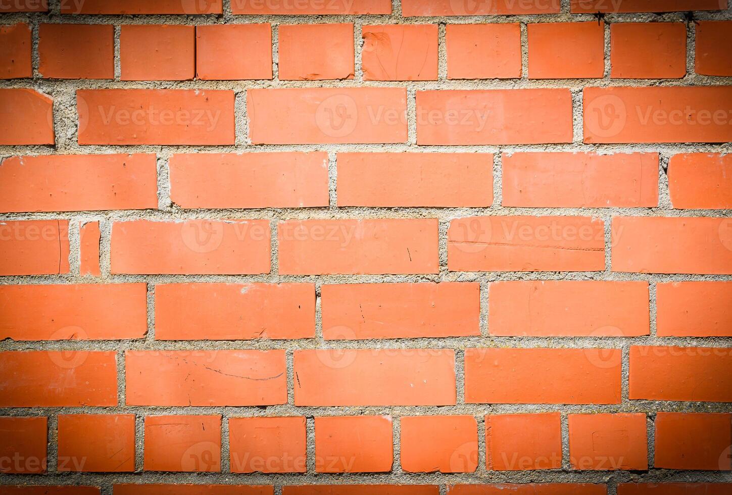 Old and aged red brick wall texture background with vignetting 1 photo