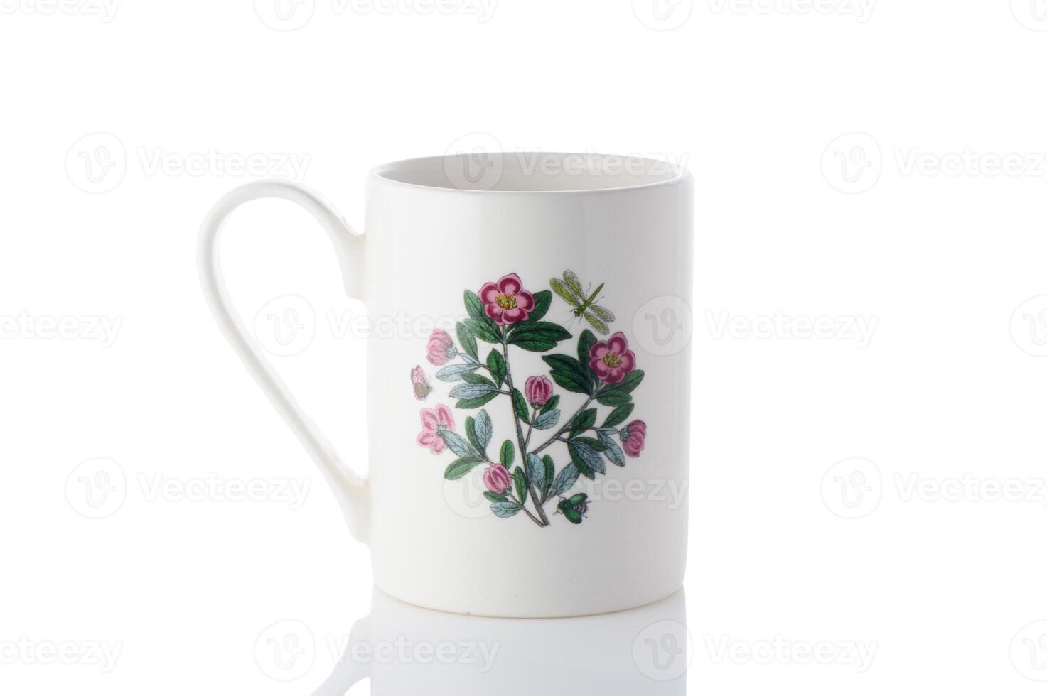 cup with a flower painted on it on a white background. Isolate 2 photo