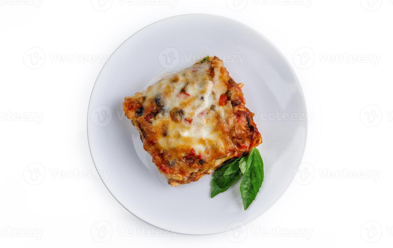 Portion of tasty lasagna, isolated on white photo