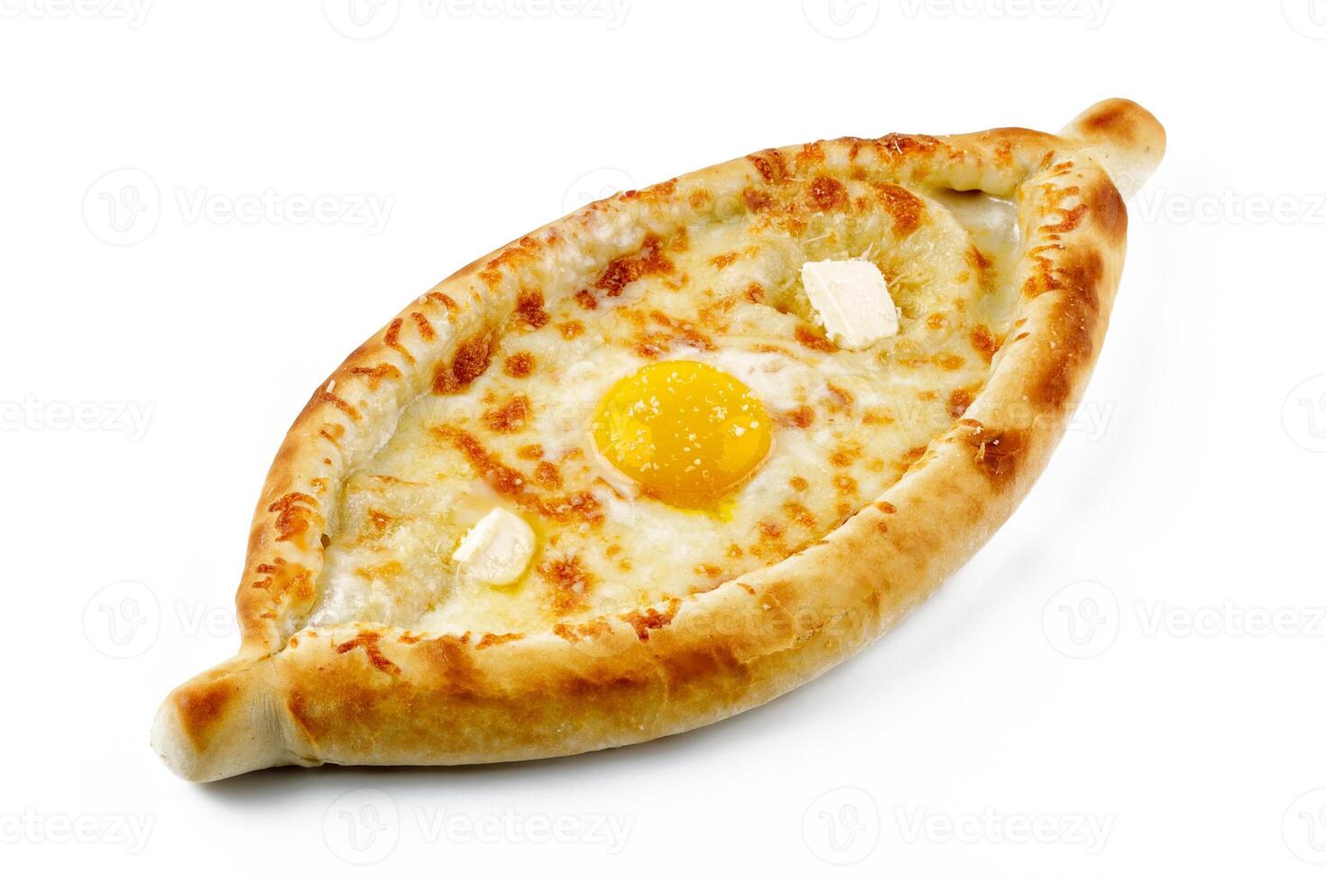 traditional Georgian dish of cheese-filled bread - khachapuri in adjarian style with egg and butter isolated on white background photo