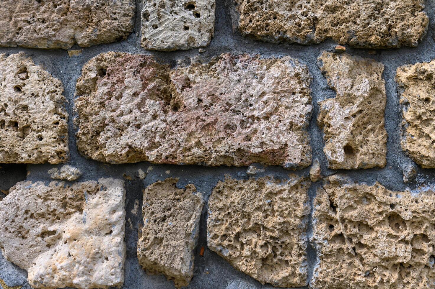 Background of ancient brick wall. Texture of old amphitheater stone. 1 photo