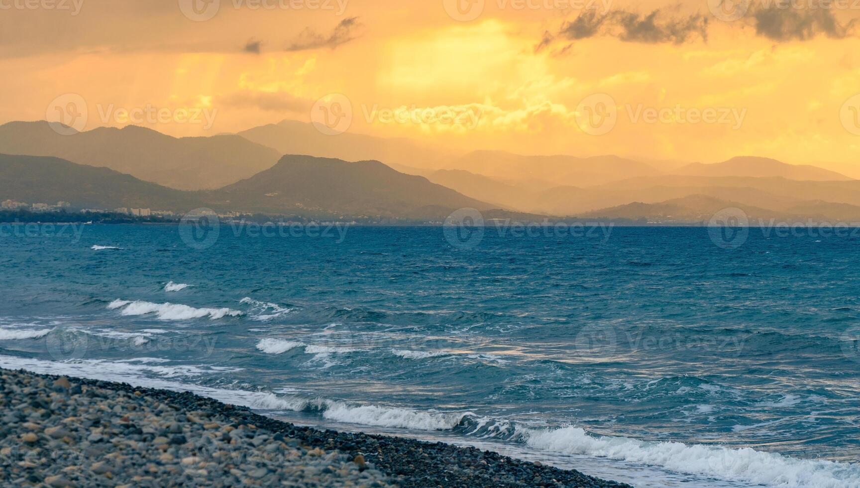 Colorful panoramic view of Sicily coastline with cloudy sunset sky, Mediterranean sea and mountains on background photo